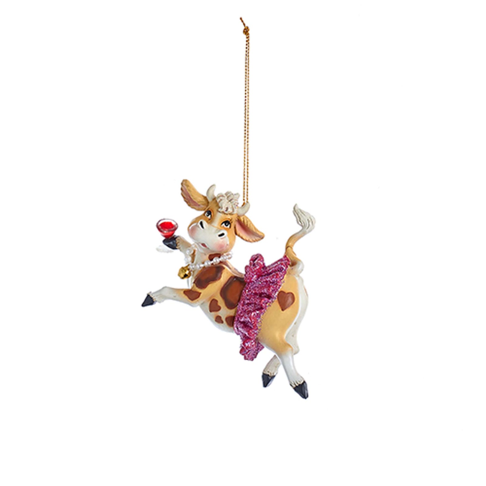 Cow ornament wearing glittery skirt and holding a glass of red wine, holiday themed.