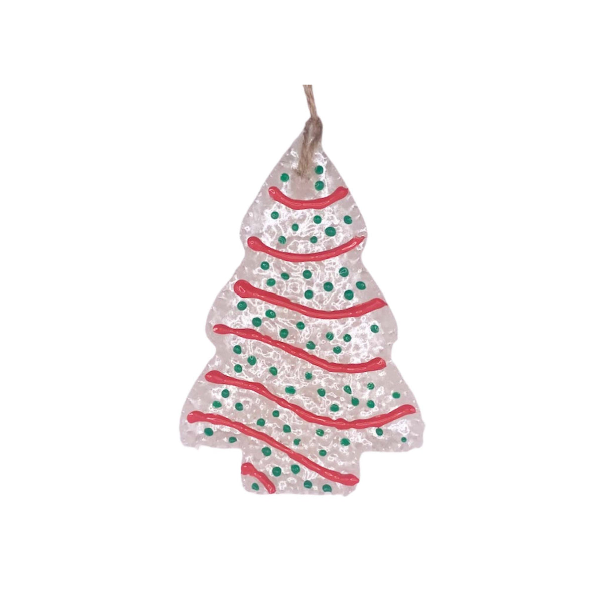 White tree-shaped air freshener with red icing-style stripes, green dotted sprinkles, and twine loop for hanging.