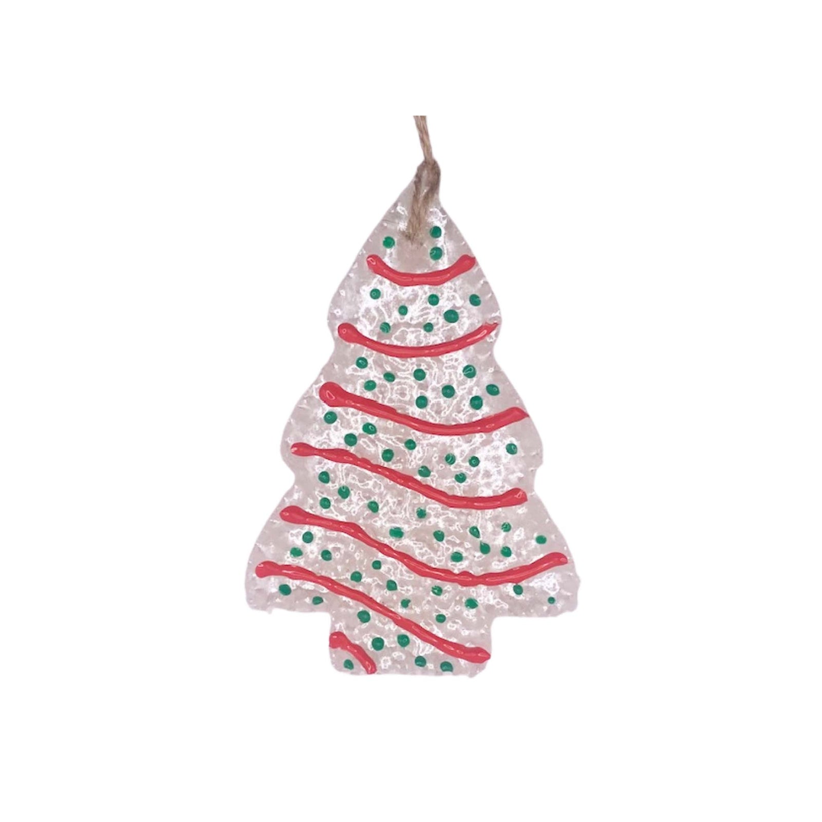 White tree-shaped air freshener with red icing-style stripes, green dotted sprinkles, and twine loop for hanging.