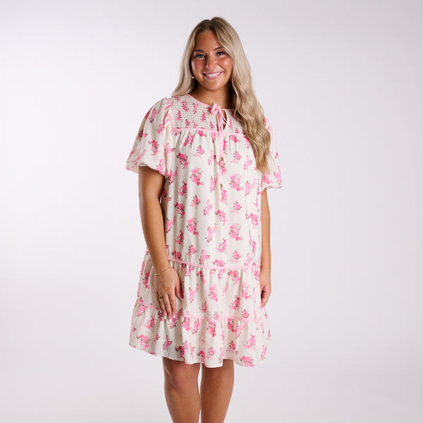 Woman wearing a floral dress on a white background