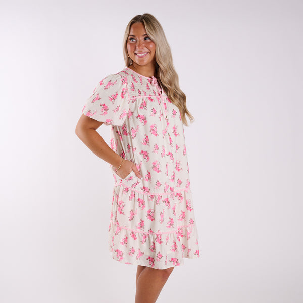 Woman wearing a floral dress on a white background