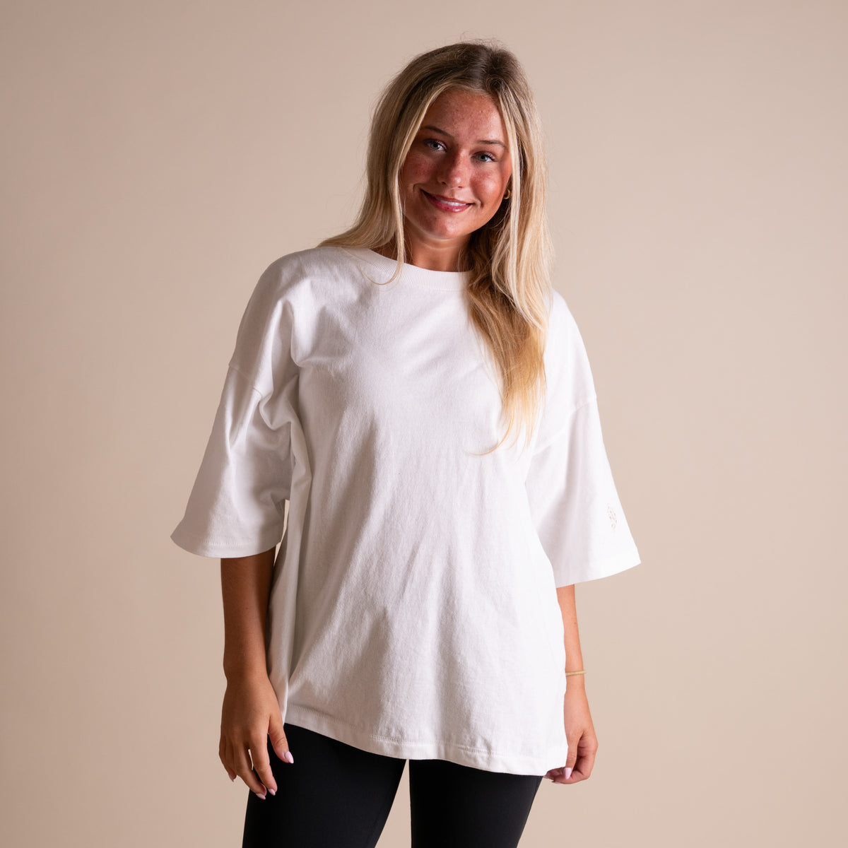 Woman wearing FP Movement Tackle Tee in White