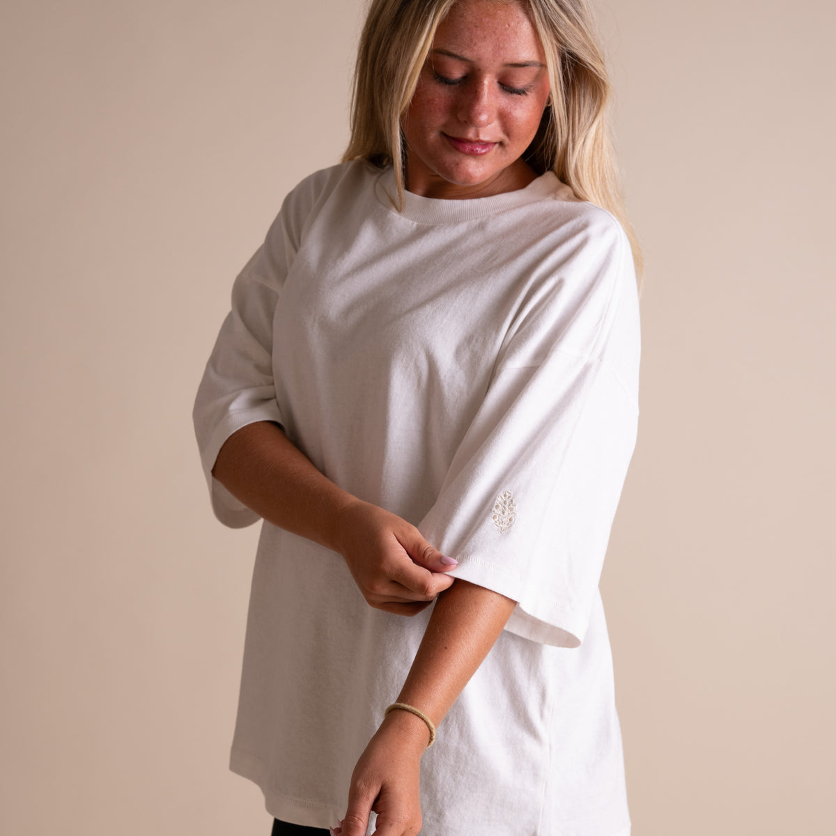 Woman wearing FP Movement Tackle Tee in White