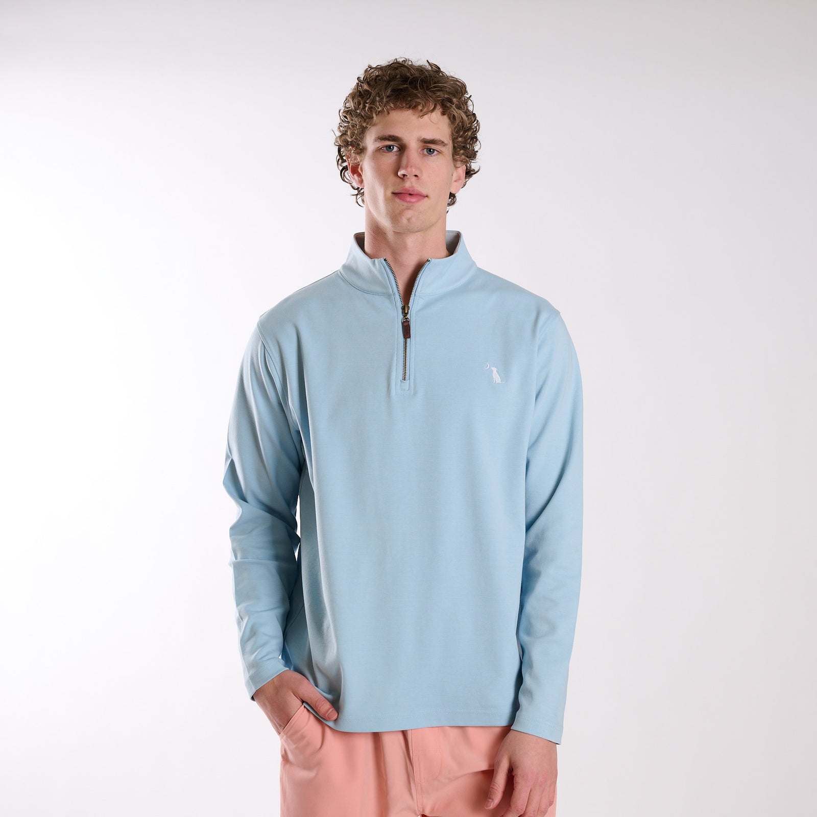 Man wearing Local Boy Outfitters Bentley Quarter Zip Pullover in Columbia Blue on a white background