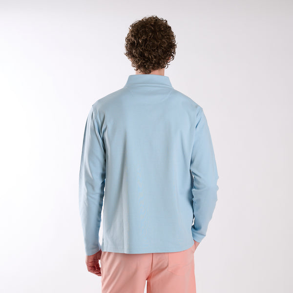 Man wearing Local Boy Outfitters Bentley Quarter Zip Pullover in Columbia Blue on a white background
