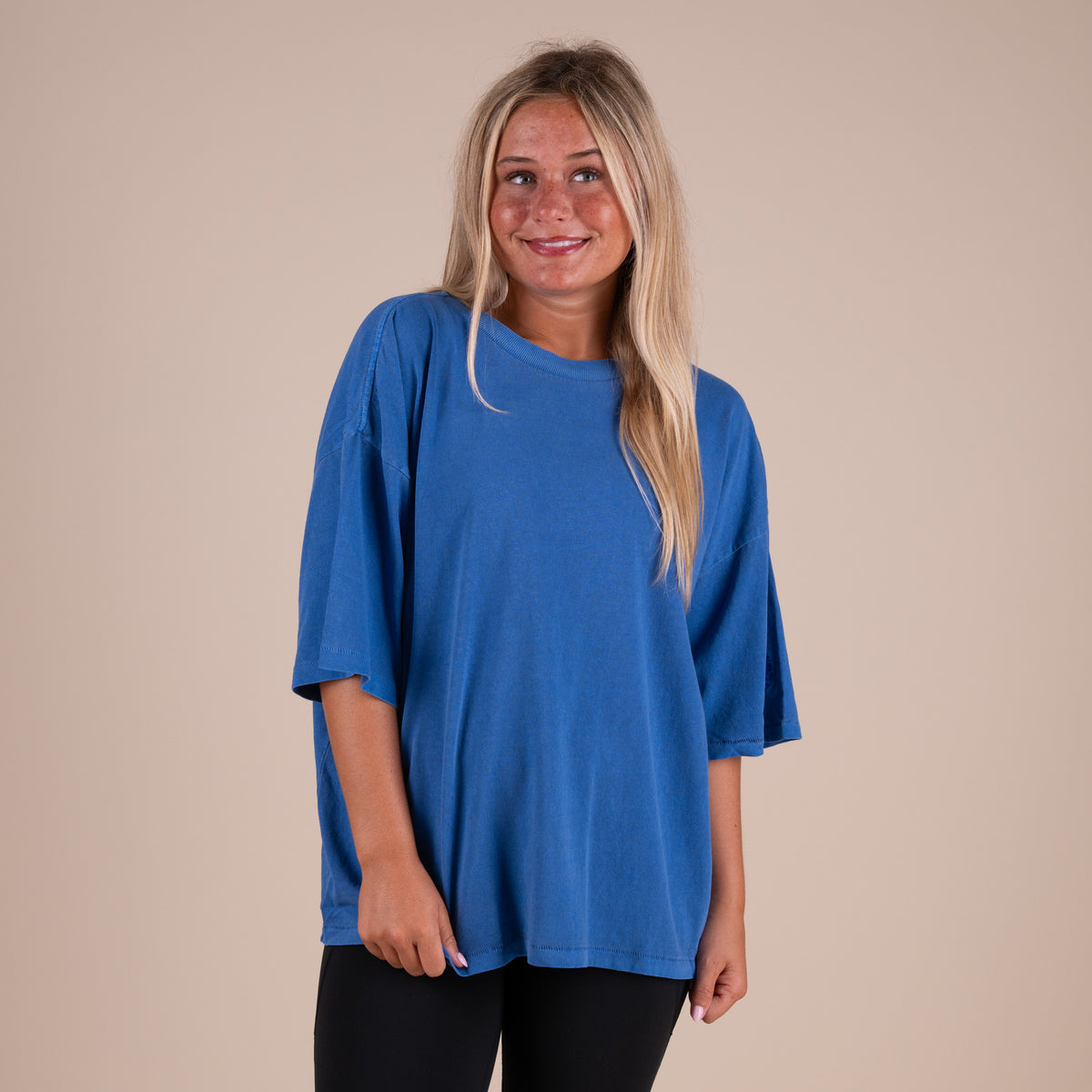 Woman wearing FP Movement Tackle Tee in Light Cobalt Blue