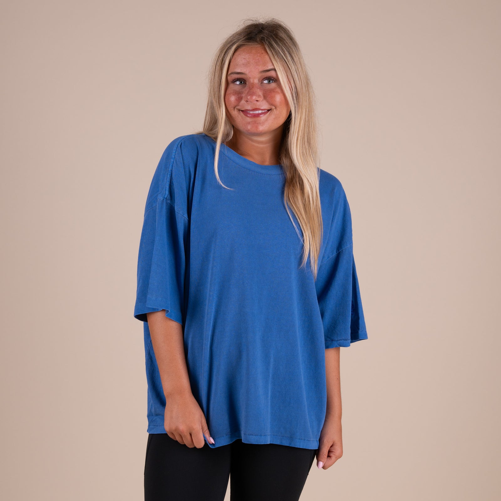 Woman wearing FP Movement Tackle Tee in Light Cobalt Blue