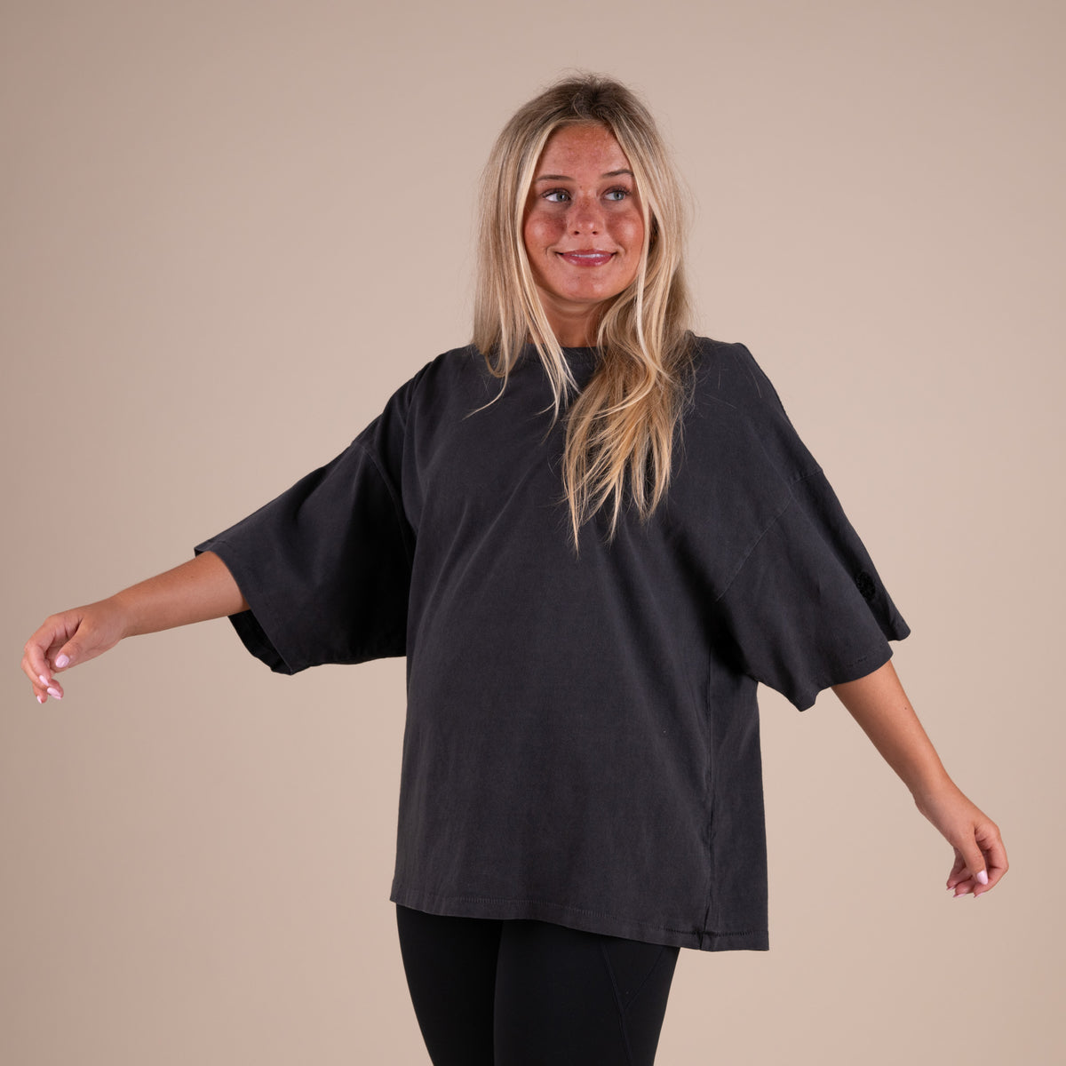 Woman wearing FP Movement Tackle Tee in Black