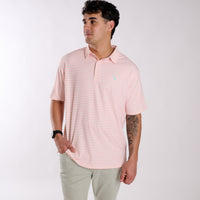 Man wearing a peach and white striped polo.