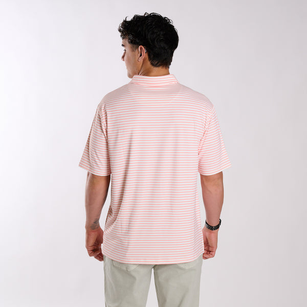 Back of man wearing a peach and white polo.