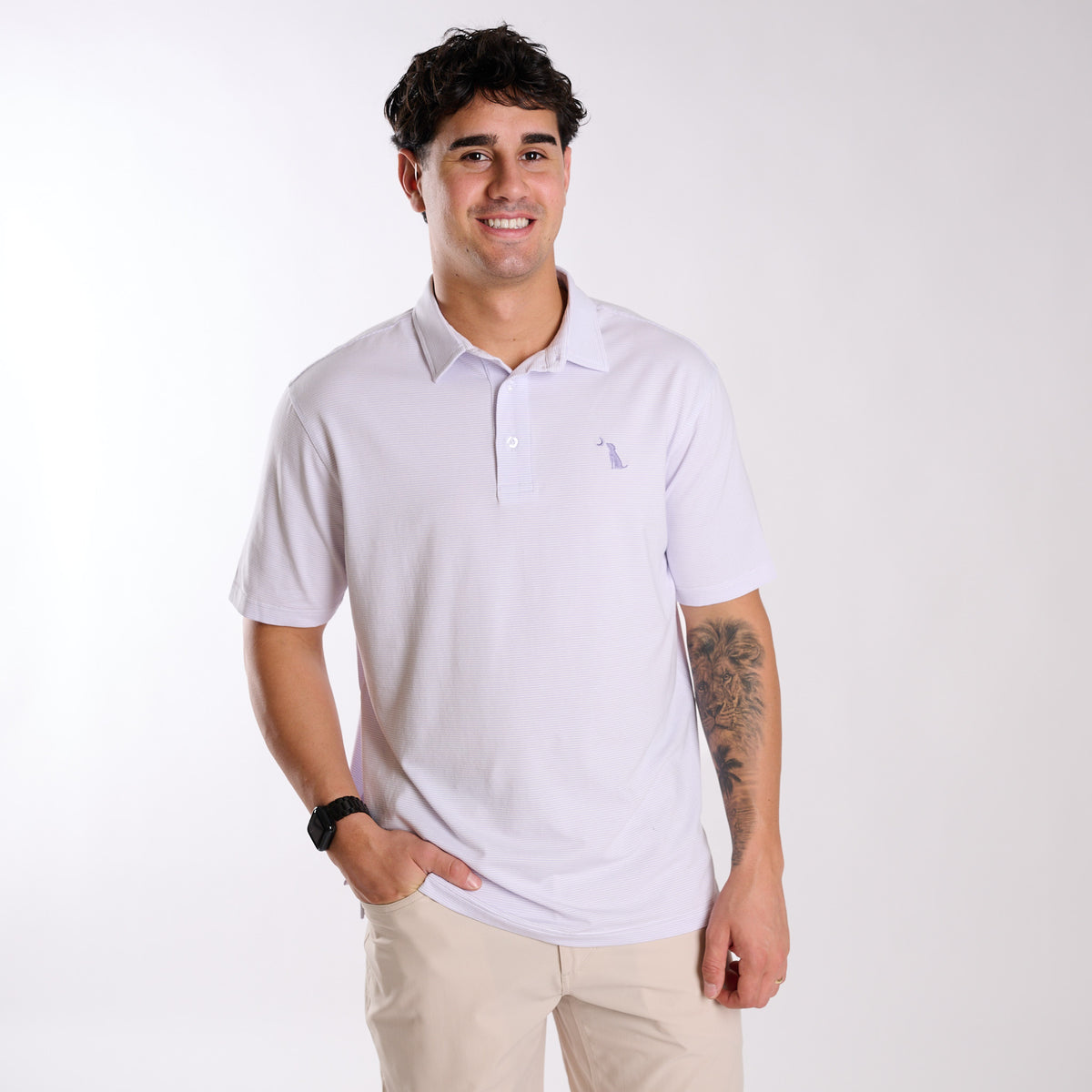 Man wearing a purple and white striped polo.