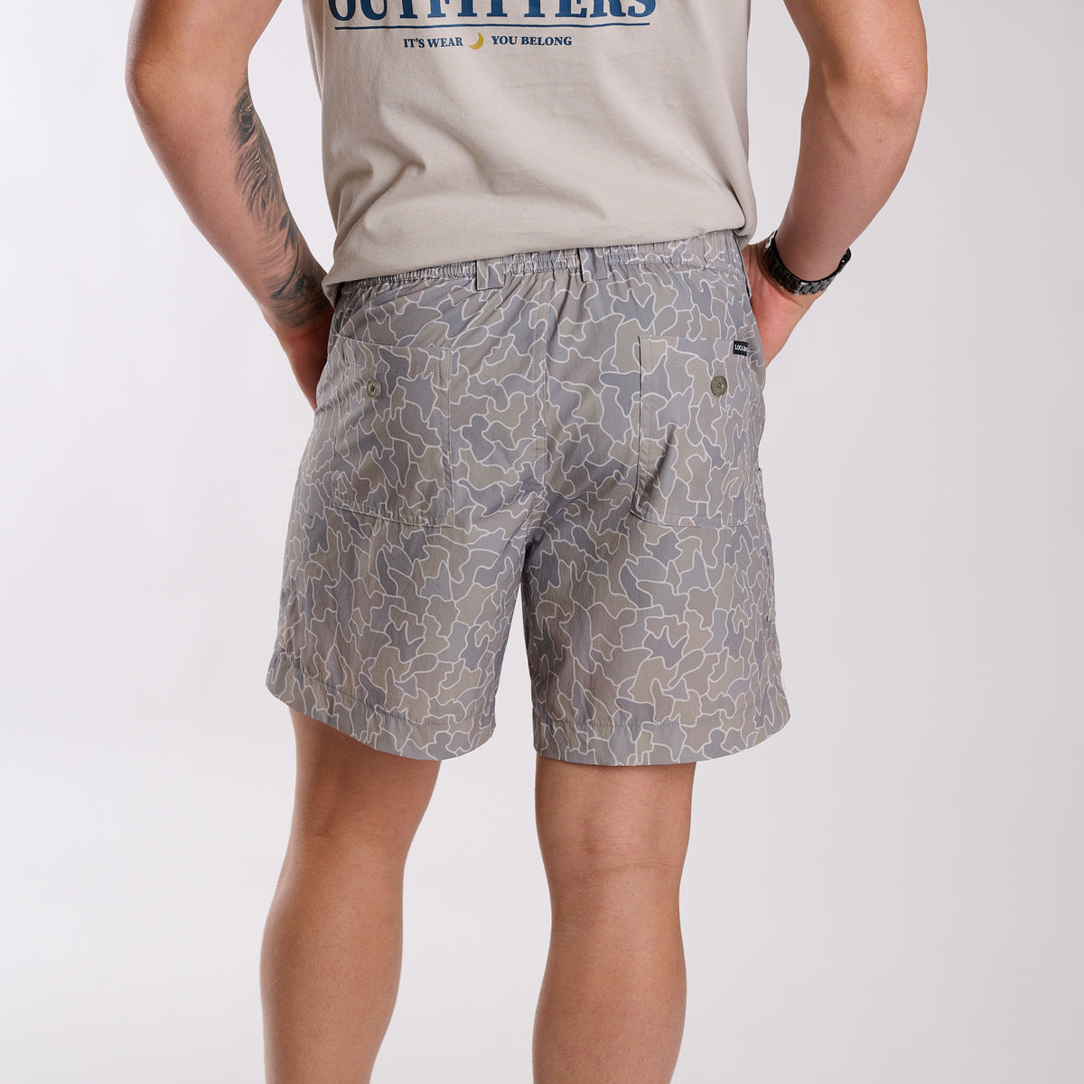 Man wearing 6 Inch Chum Shorts in Gray Cobblestone Camo in front of a white background