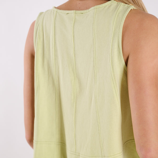  Light green sleeveless top worn by a person on a white background