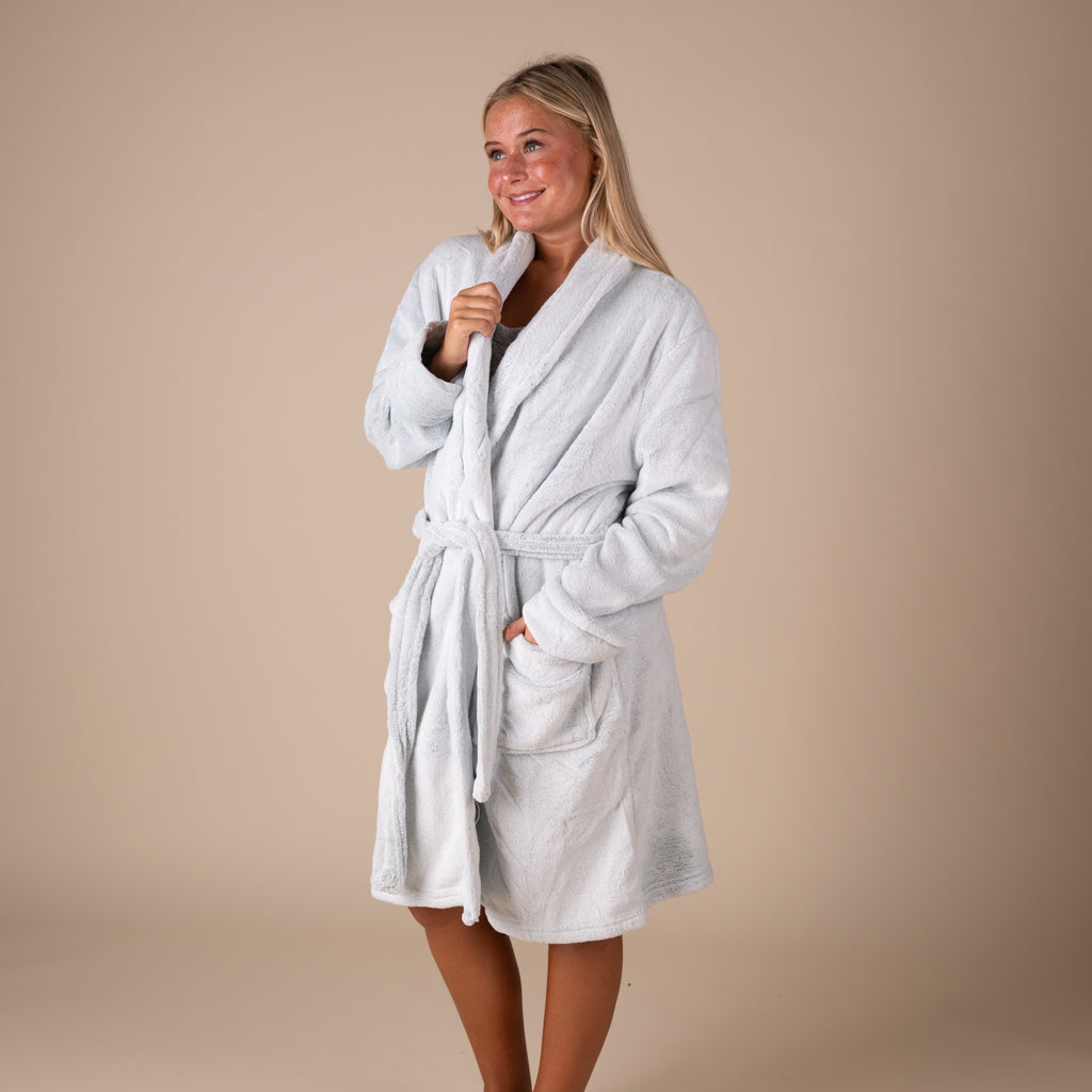 woman wearing a plush velour fabric robe in studio