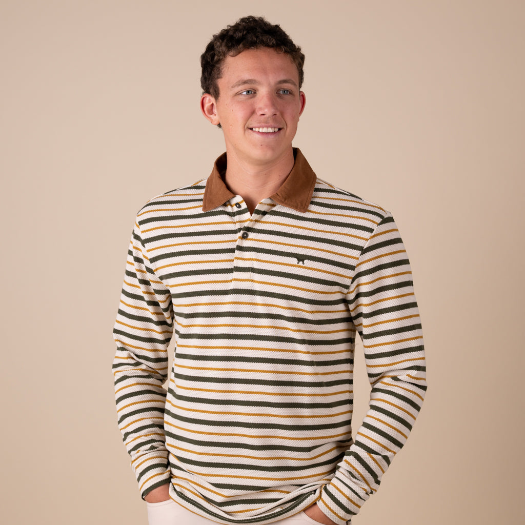 Man wearing a striped long-sleeve shirt with a brown collar on a beige background