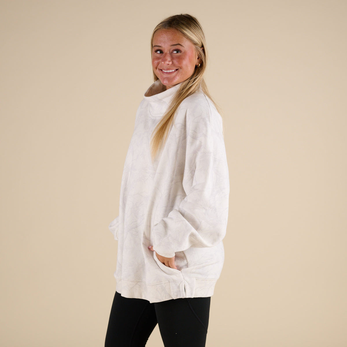 Love Bug Apparel Woodlands Camo Mock Neck Sweatshirt with side pockets and light gray and white camo print