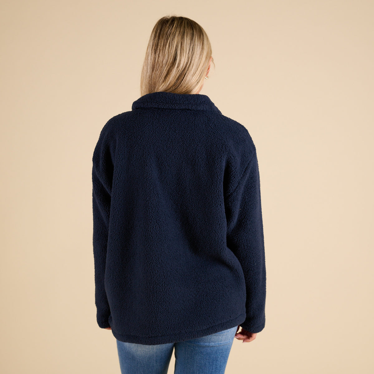 Blu Pepper 1/4 Zip Fleece Pullover in Navy with soft sherpa texture, stand collar, front kangaroo pocket, and relaxed fit shown on model.