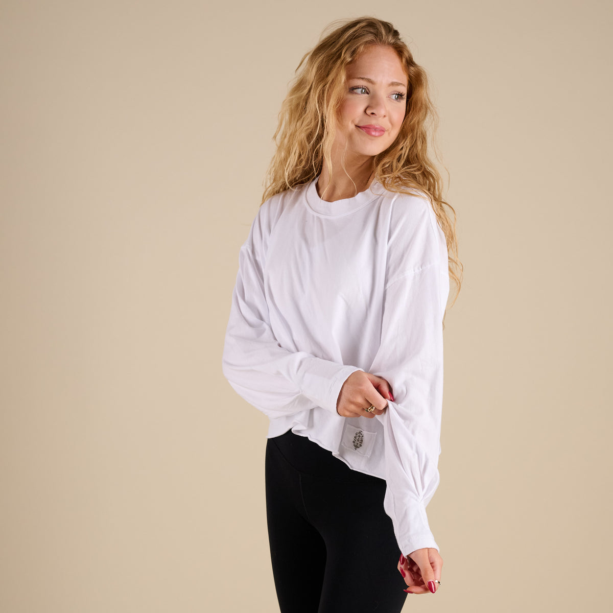 FP Movement Long Sleeve Inspire Layer in White shown on model in studio