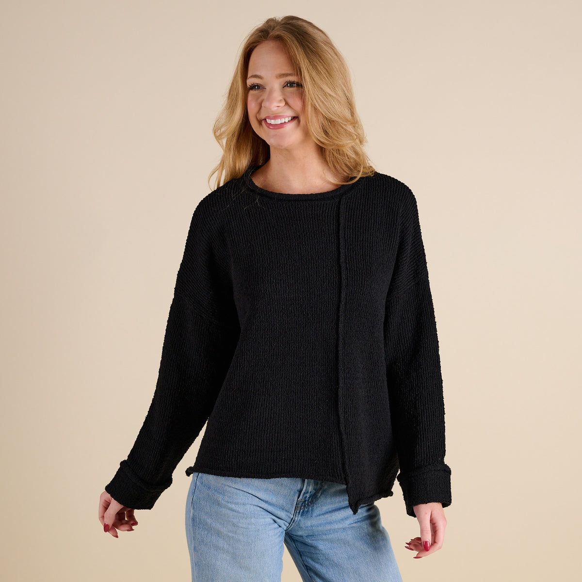 Model wearing Asymmetrical Hem Light Weight Sweater in black