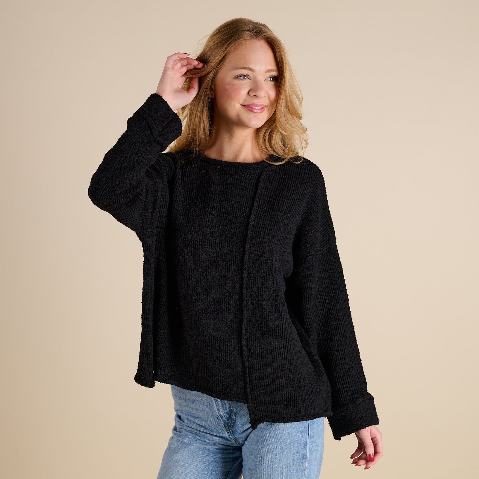Model wearing Asymmetrical Hem Light Weight Sweater in black