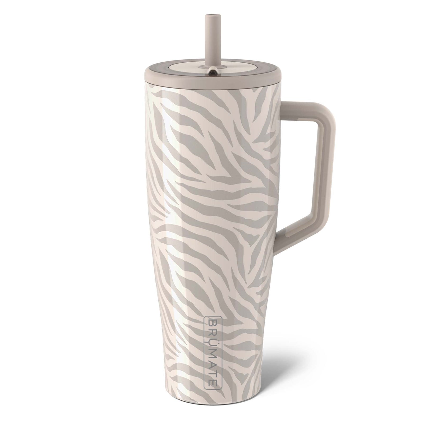 40oz Era Handled Tumbler in the newly released Zebra print featuring a zebra print in colors gray and beige. Brumate's Era tumbler is leakproof and made for stress free sips on the go. It has a fully leakproof Ü-Turn™ lid that works for both cold and carbonated beverages, ColdKey™ metal straw for minimizing the amount of plastic sitting in your water, BevGuard™ technology to keep ice for 24+ hours, and a cup-holder friendly base so you can enjoy 40oz of your favorite beverage, free of leaks and spills.