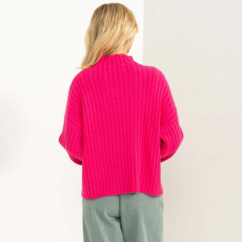 woman wearing pink sweater