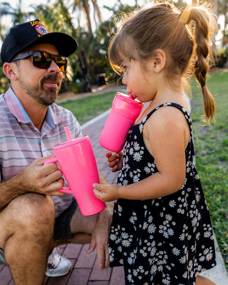 A dad and daughter sharing Brumate tumblers.