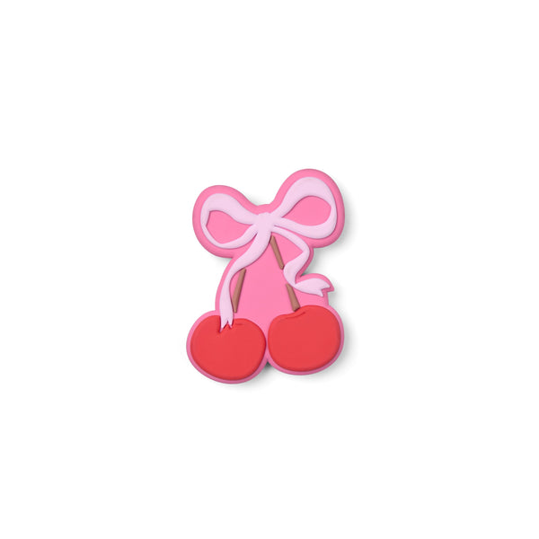 Bogg Bag Bogg Bit pink bow and red cherry charm accessory with layered design.