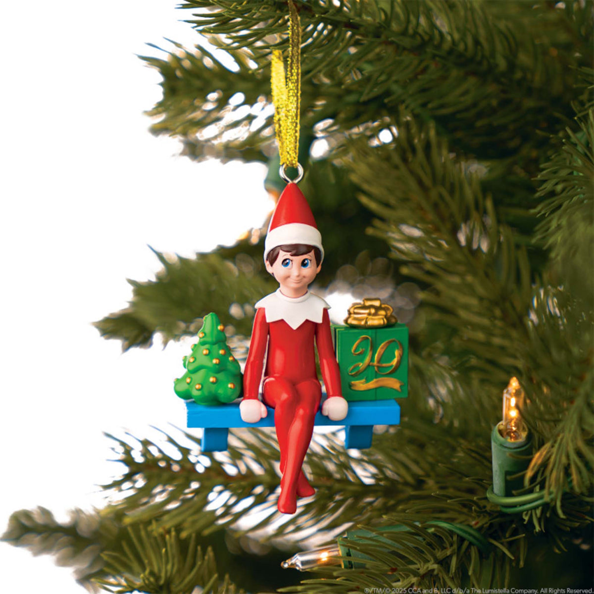 Elf on the Shelf Christmas ornament on a tree branch