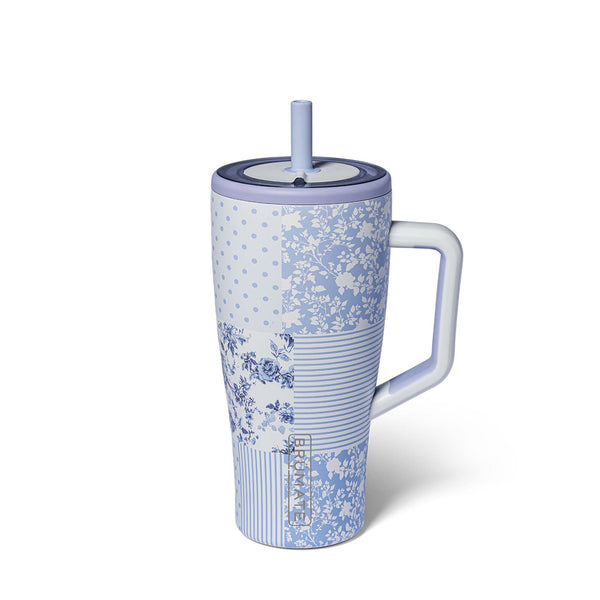 Blue floral-patterned mug with a handle and straw on a white background