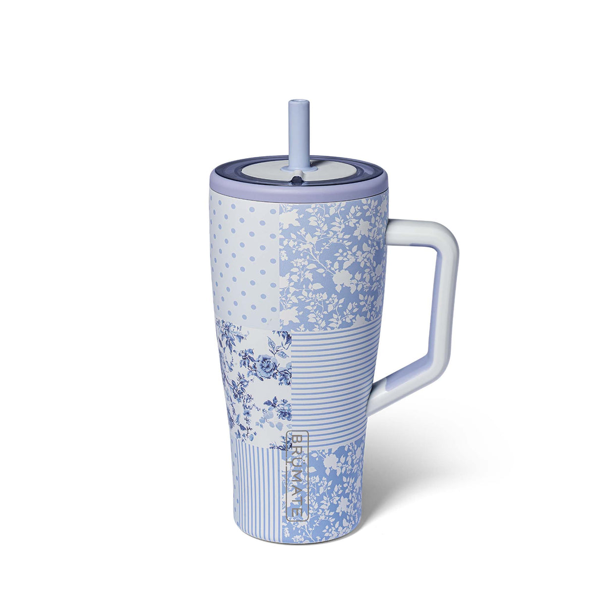 Blue floral-patterned mug with a handle and straw on a white background