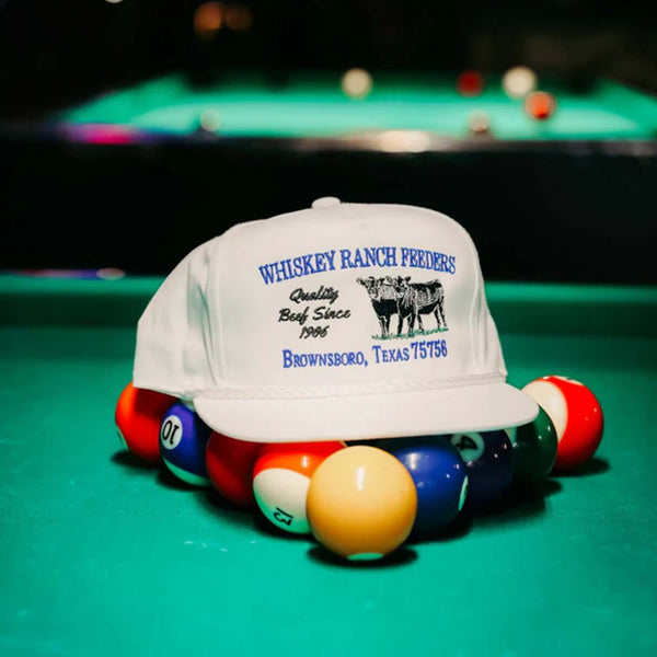 Front view of the Whiskey Bent Hat Company Feeders Rope Hat featuring a 5-panel design with a structured 4-inch crown, rope detail above the brim, and classic front panel with visible stitching.
