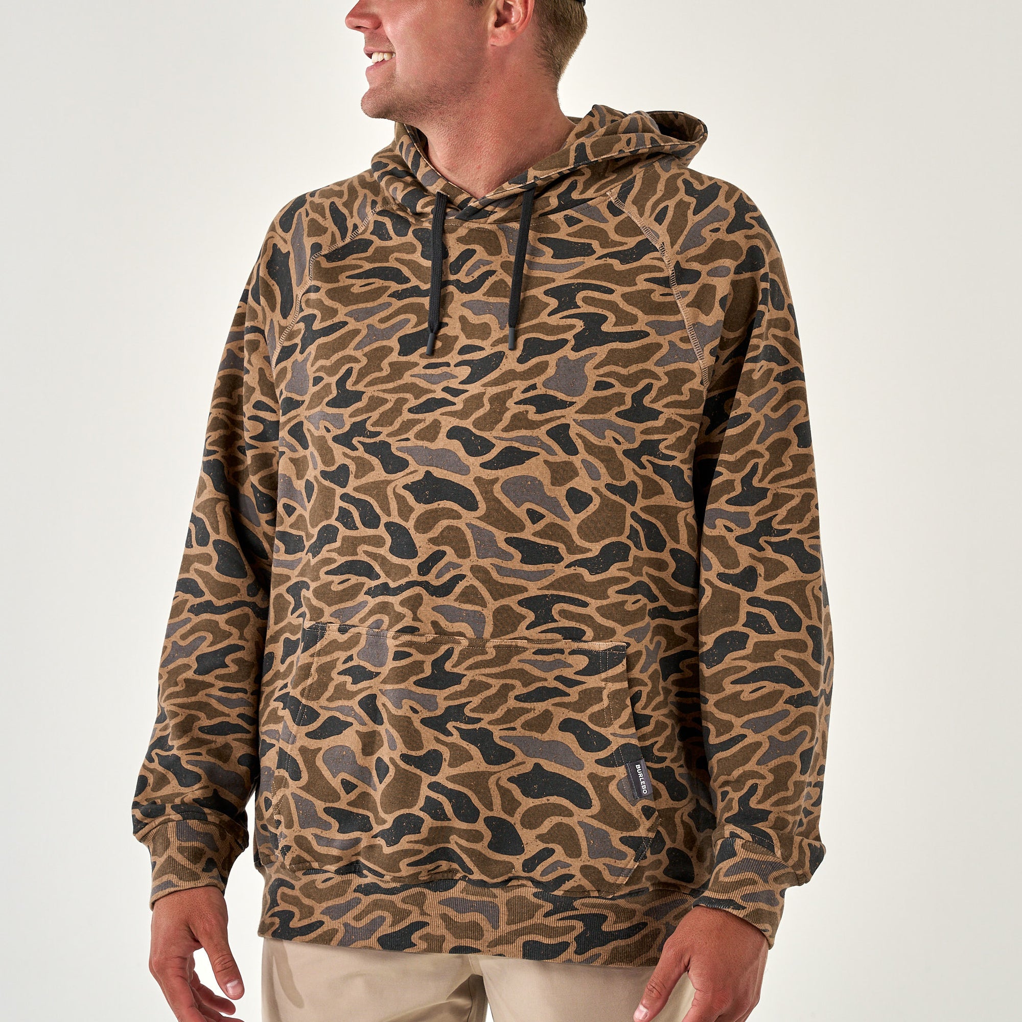 Burlebo brown camo hoodie shown from the side-front angle, highlighting relaxed fit and overall camouflage design.