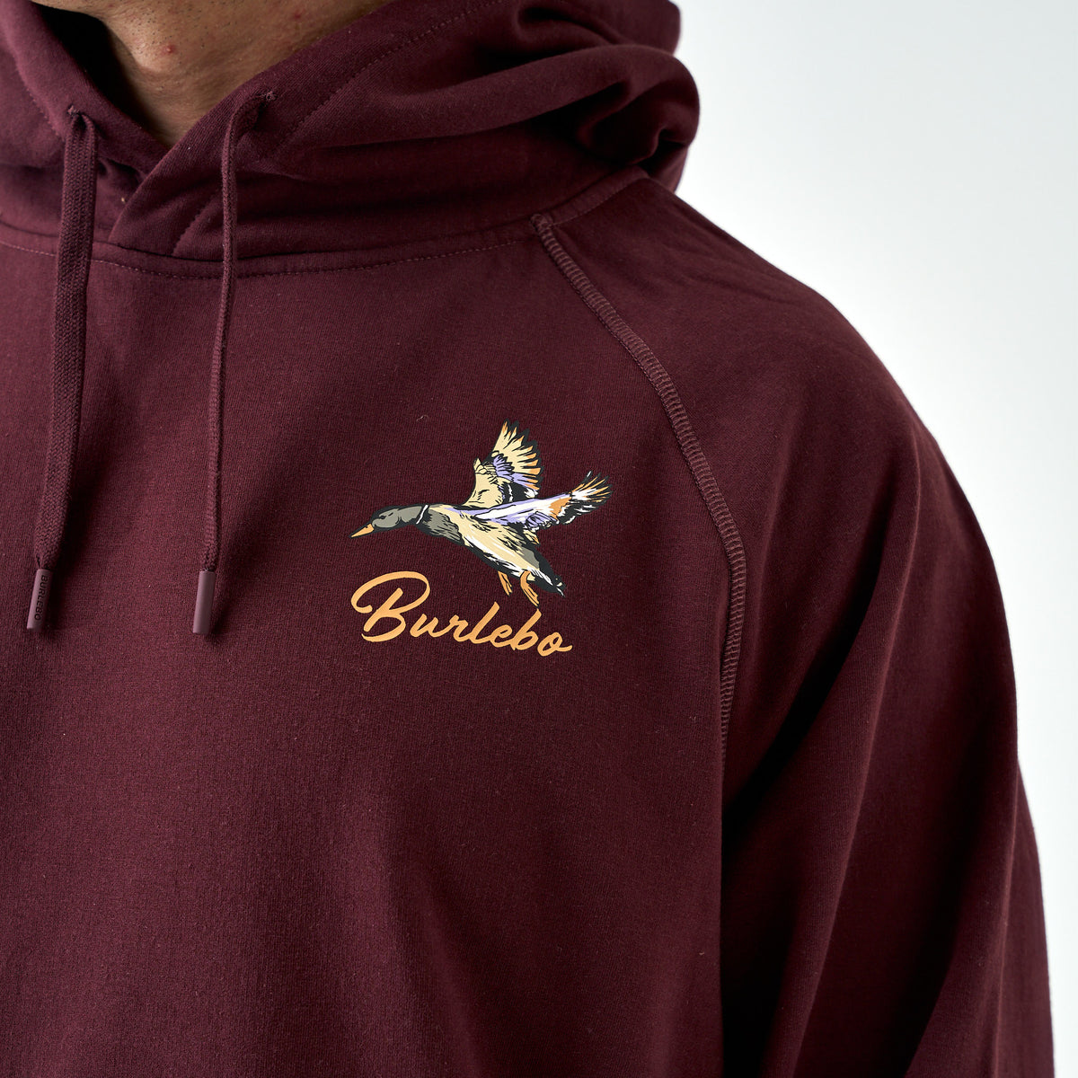 Maroon Burlebo hoodie with flying duck and Burlebo script logo printed on left chest.