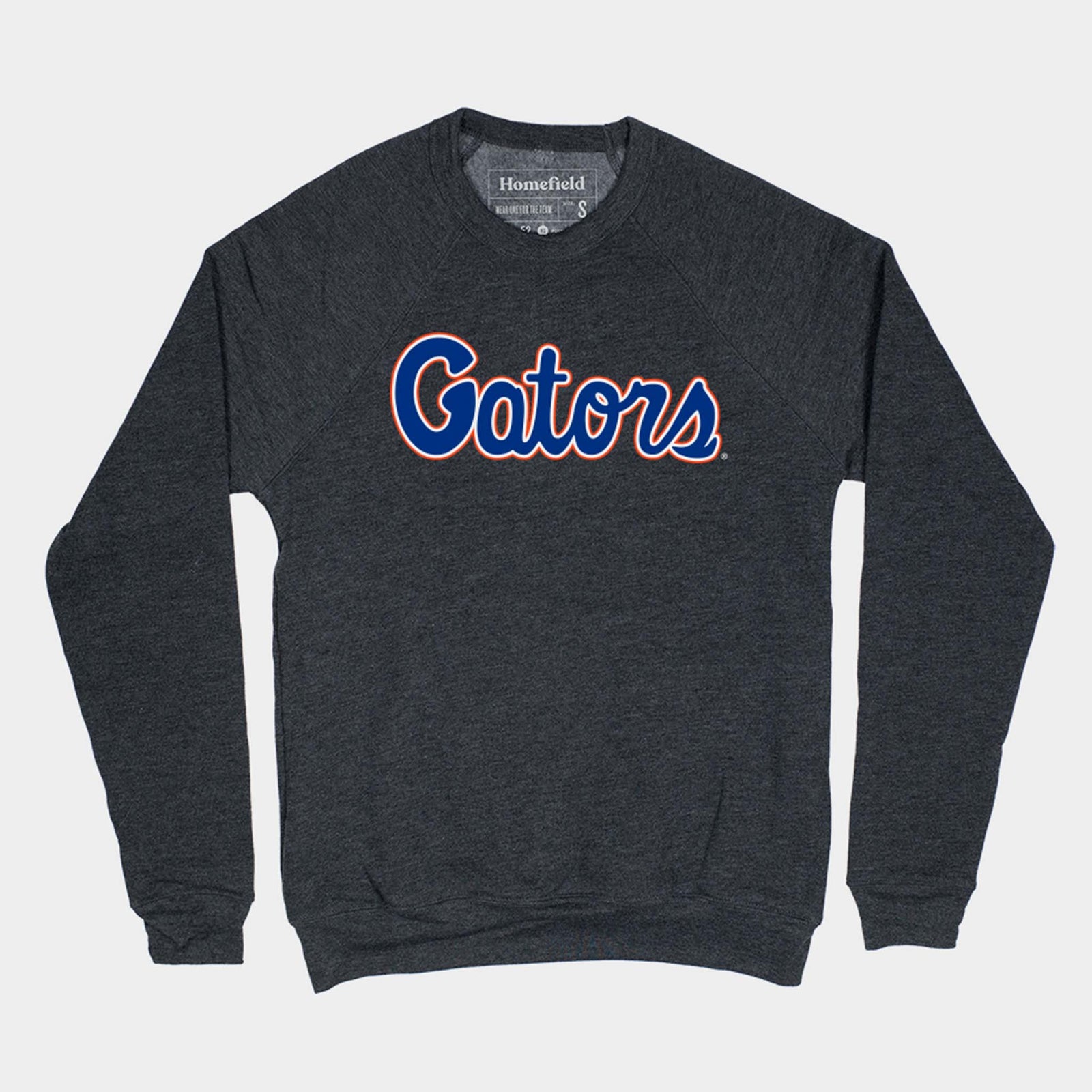Heather charcoal Florida Gators crewneck sweatshirt with bold “Gators” script in blue outlined in orange across the chest.