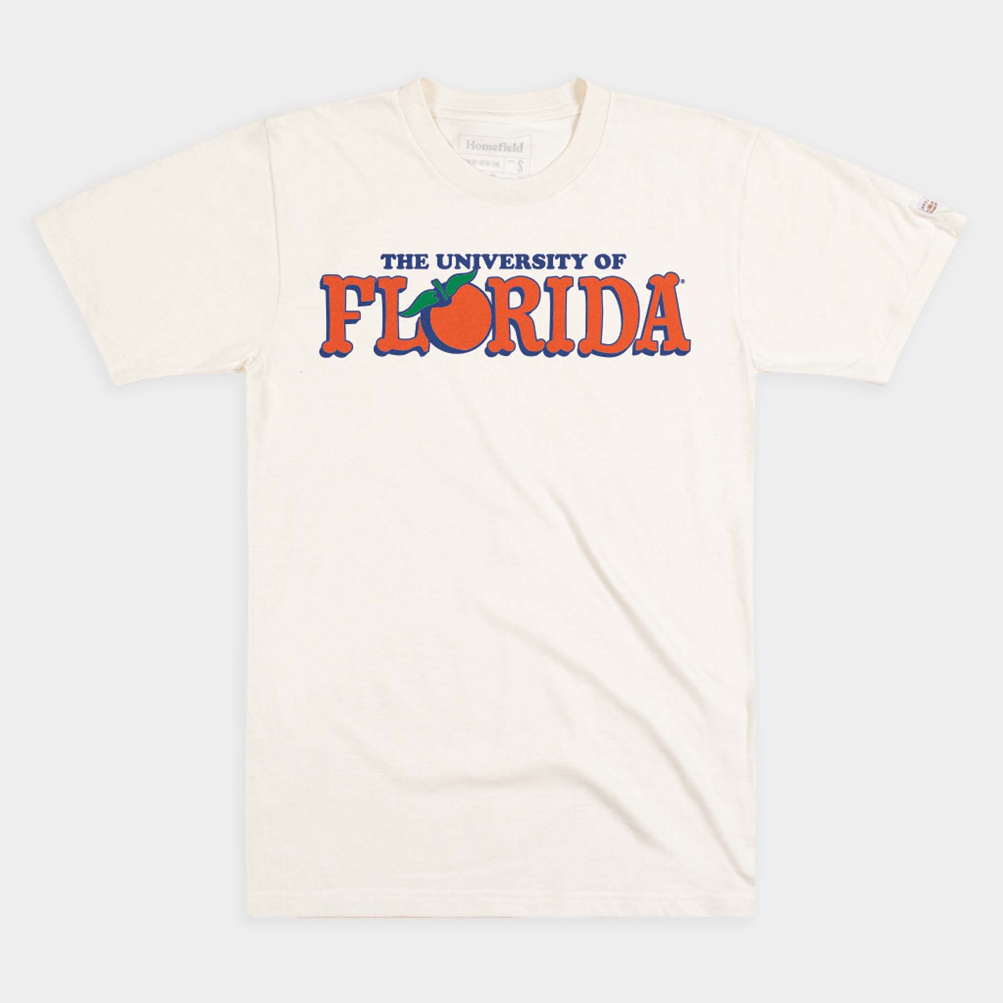 Cream University of Florida t-shirt with bold orange and blue lettering and an orange fruit graphic replacing the “O” in Florida.