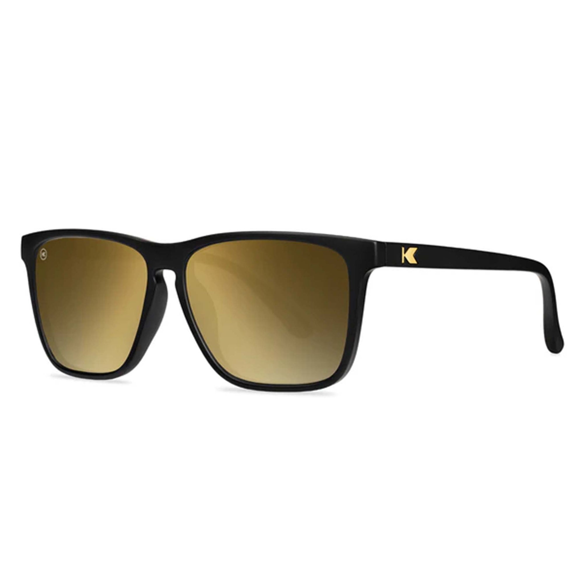 Black sunglasses with gold gradient lenses on a white background