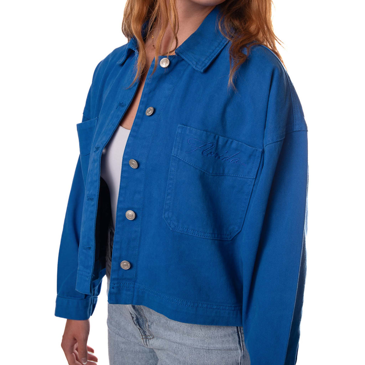 Front view of a woman wearing the Florida embroidered twill jacket. 