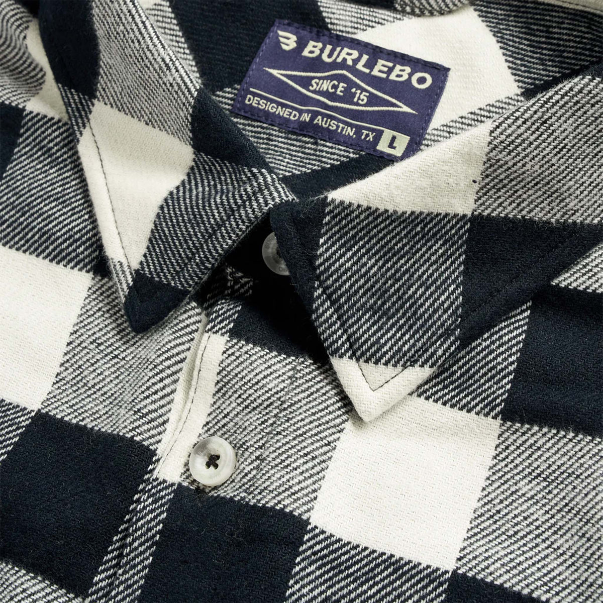 Close-up of a checkered shirt with a Burlebo label