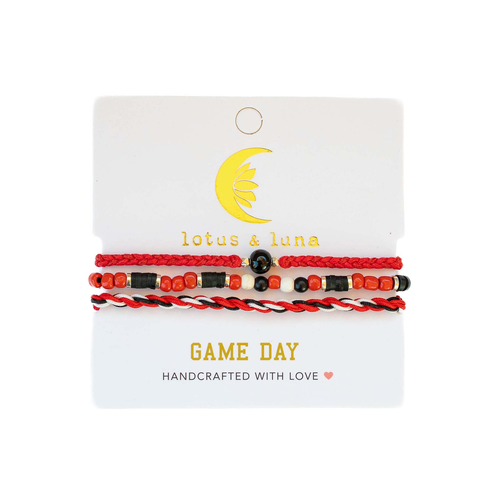 Game Day bracelet set by Lotus & Luna in red, black, and white, featuring beads and twisted cords on branded card.