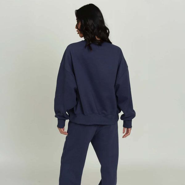 back view of a Dark Navy Blue Gold Hinge crew neck sweatshirt with blank back.