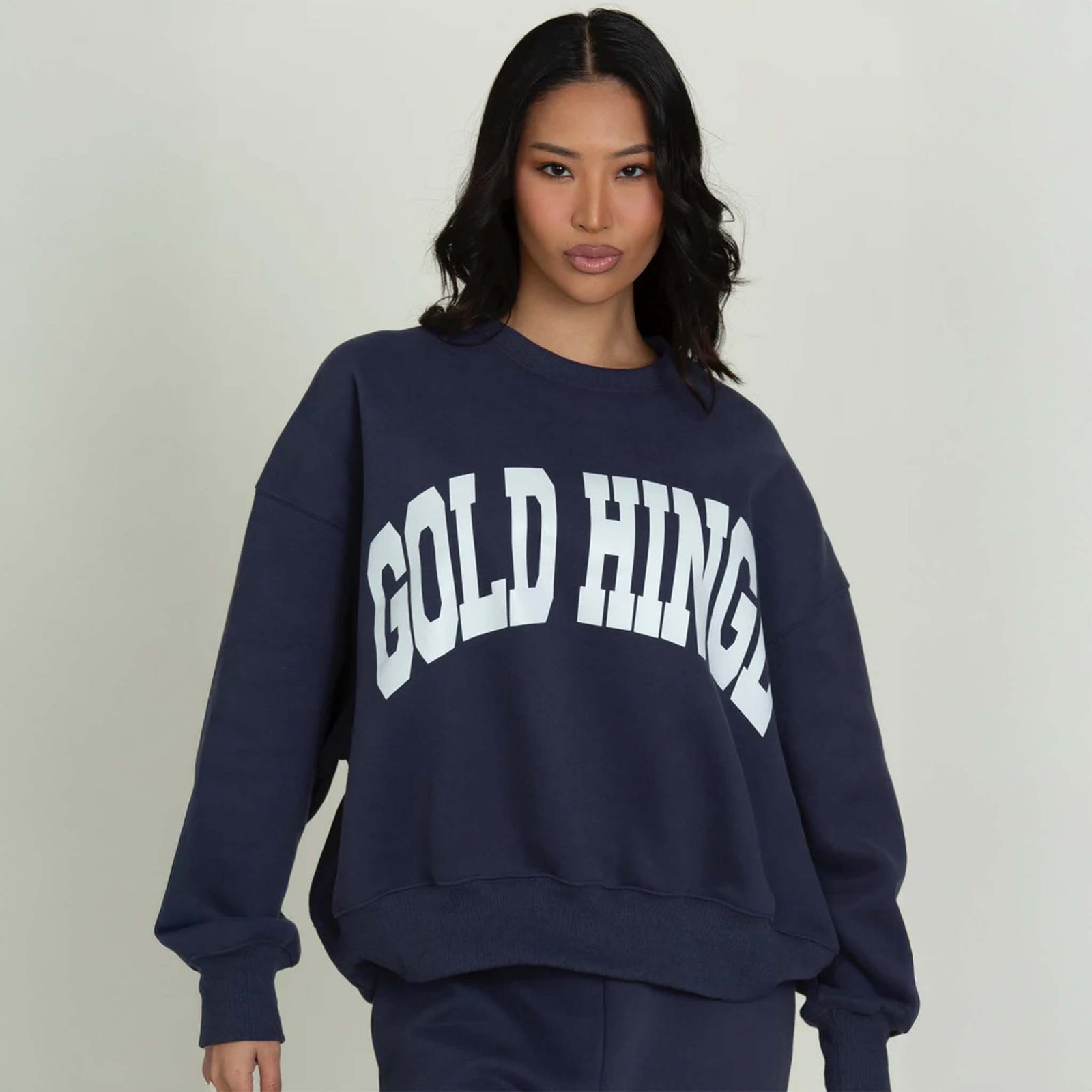 Front view of a Dark Navy Blue Gold Hinge crew neck sweatshirt with large arch gold hinge logo across the chest.