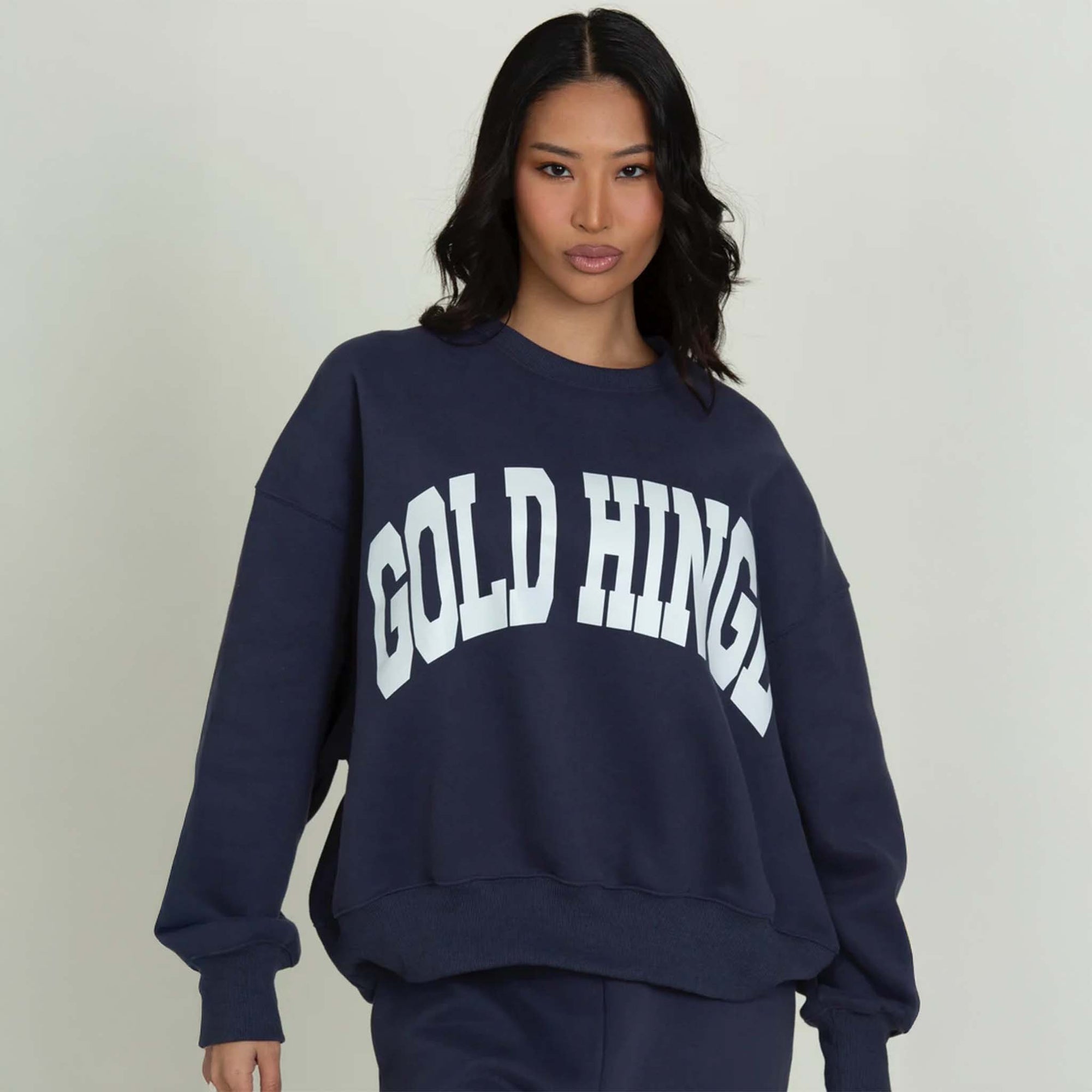 Front view of a Dark Navy Blue Gold Hinge crew neck sweatshirt with large arch gold hinge logo across the chest.