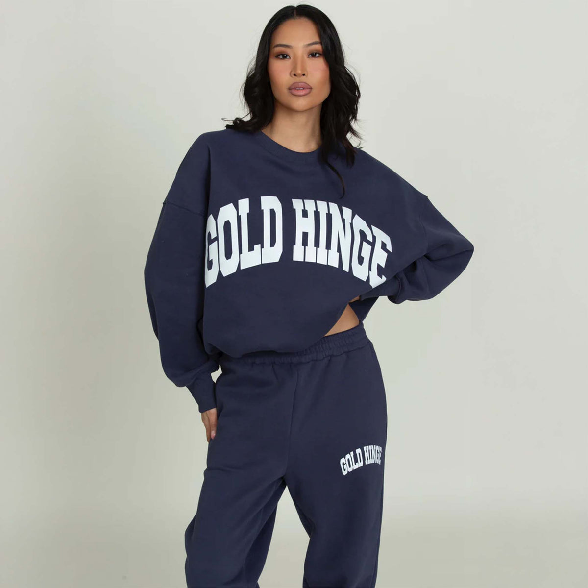 Front view of a Dark Navy Blue Gold Hinge crew neck sweatshirt with large arch gold hinge logo across the chest.