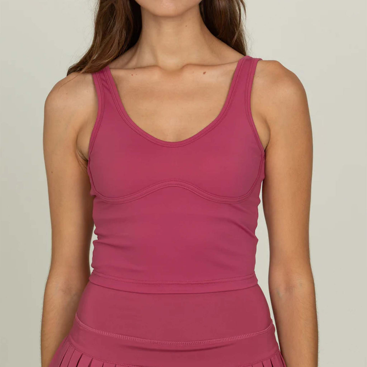 Close-up front view of Gold Hinge cropped tank in raspberry.