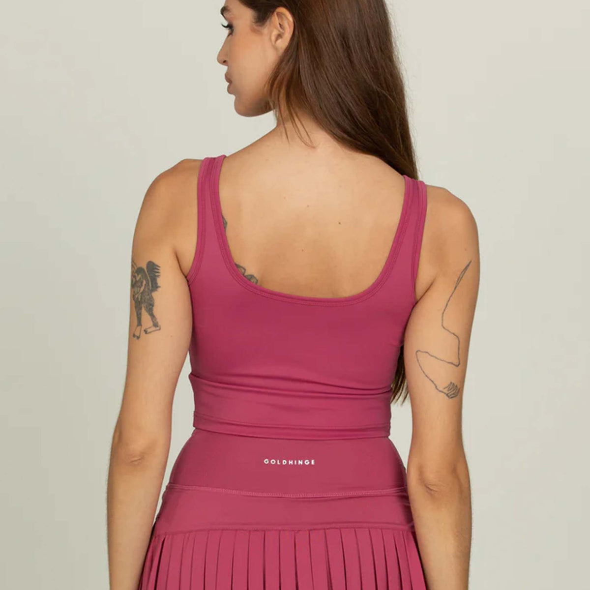 Back view of Gold Hinge cropped tank in raspberry with scoop neckline.