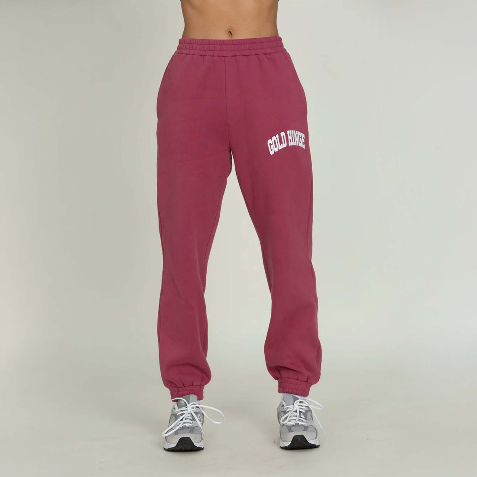 Front view of Gold Hinge jogger sweatpants in pale mulberry with logo detail at hip.
