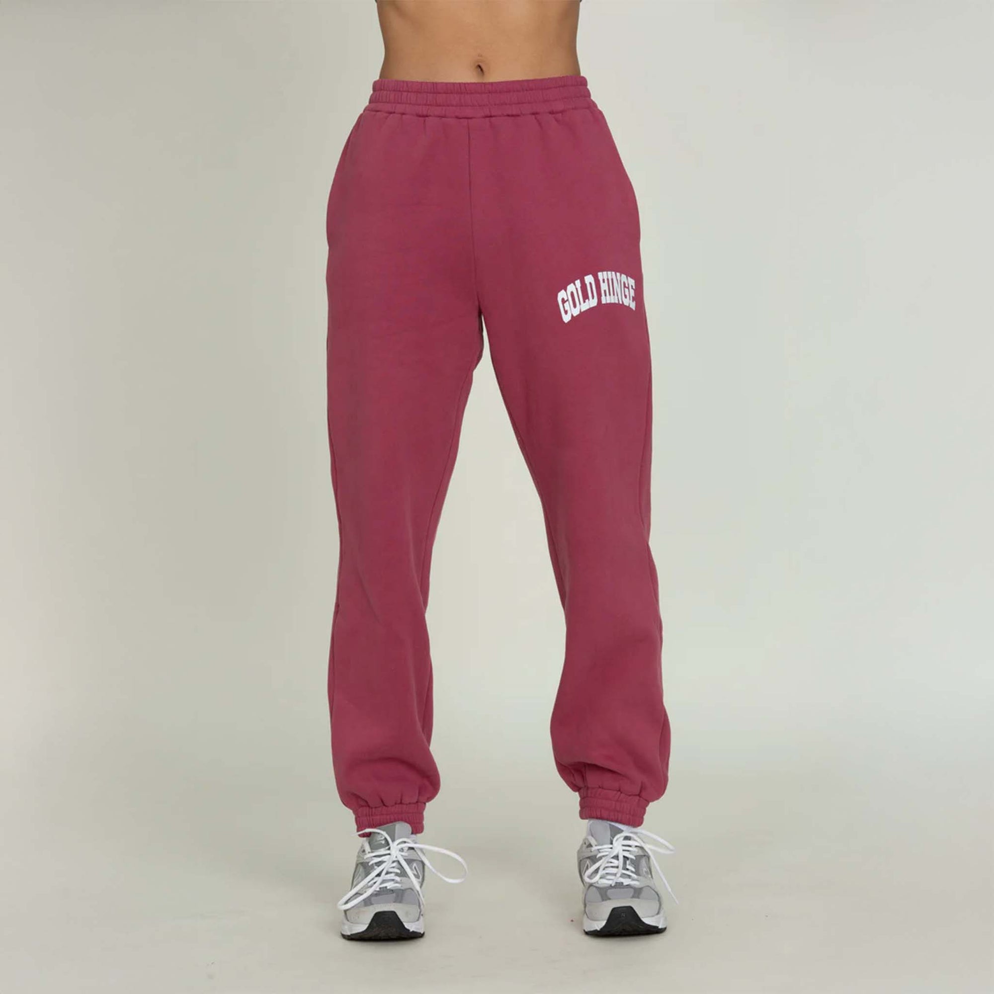Front view of Gold Hinge jogger sweatpants in pale mulberry with logo detail at hip.