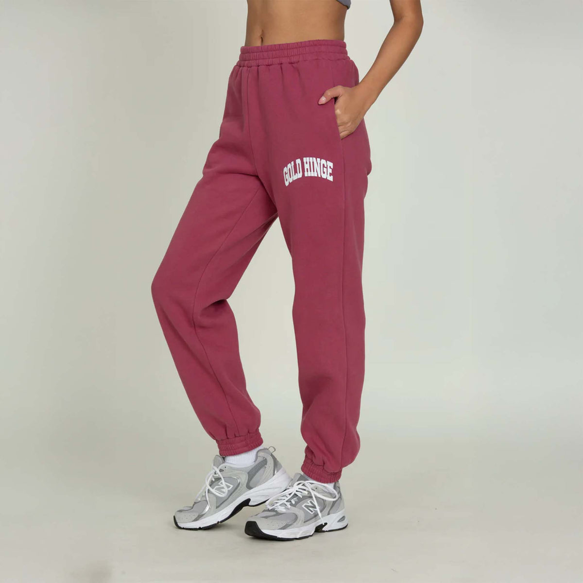 Side view of Gold Hinge jogger sweatpants in pale mulberry showing relaxed jogger fit.
