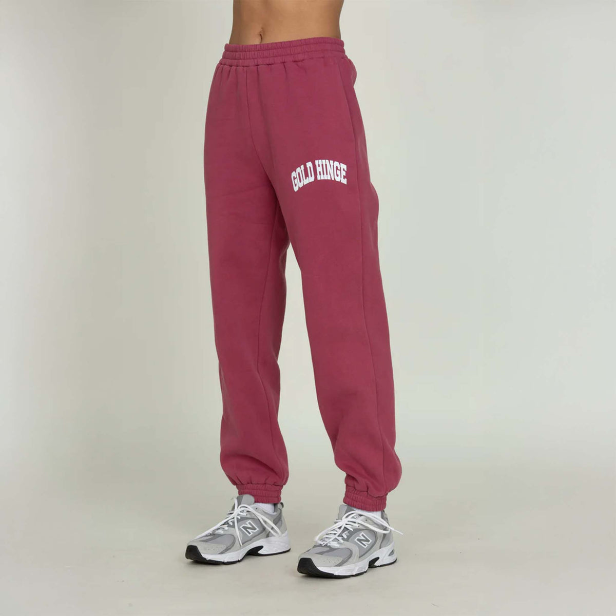 Side view of Gold Hinge jogger sweatpants in pale mulberry showing relaxed jogger fit.